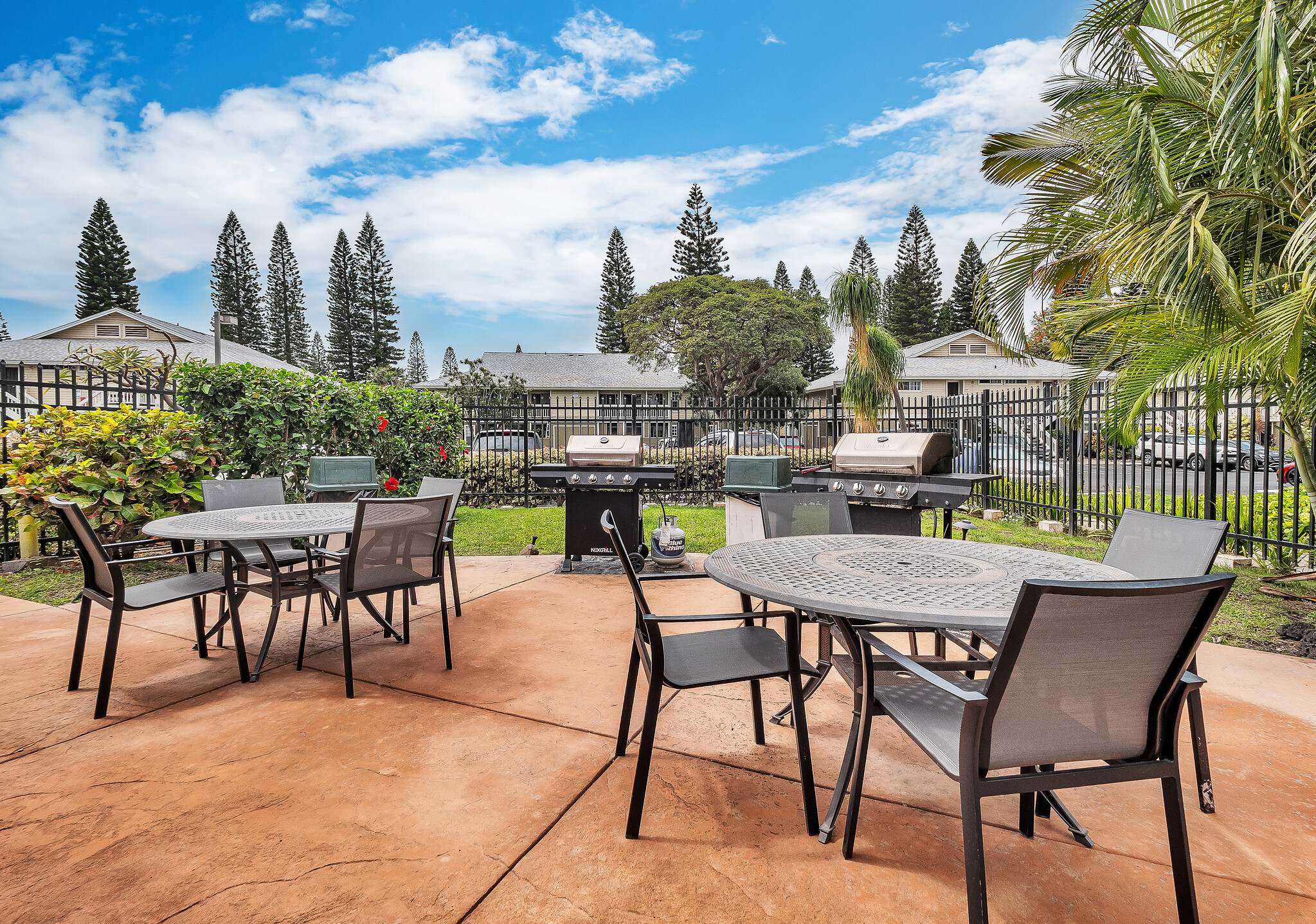 68-3883 Lua Kula Street, Unit 2102 Waikoloa, HI 96738 - Photo 23 of 29 a view of a chairs and table in a patio