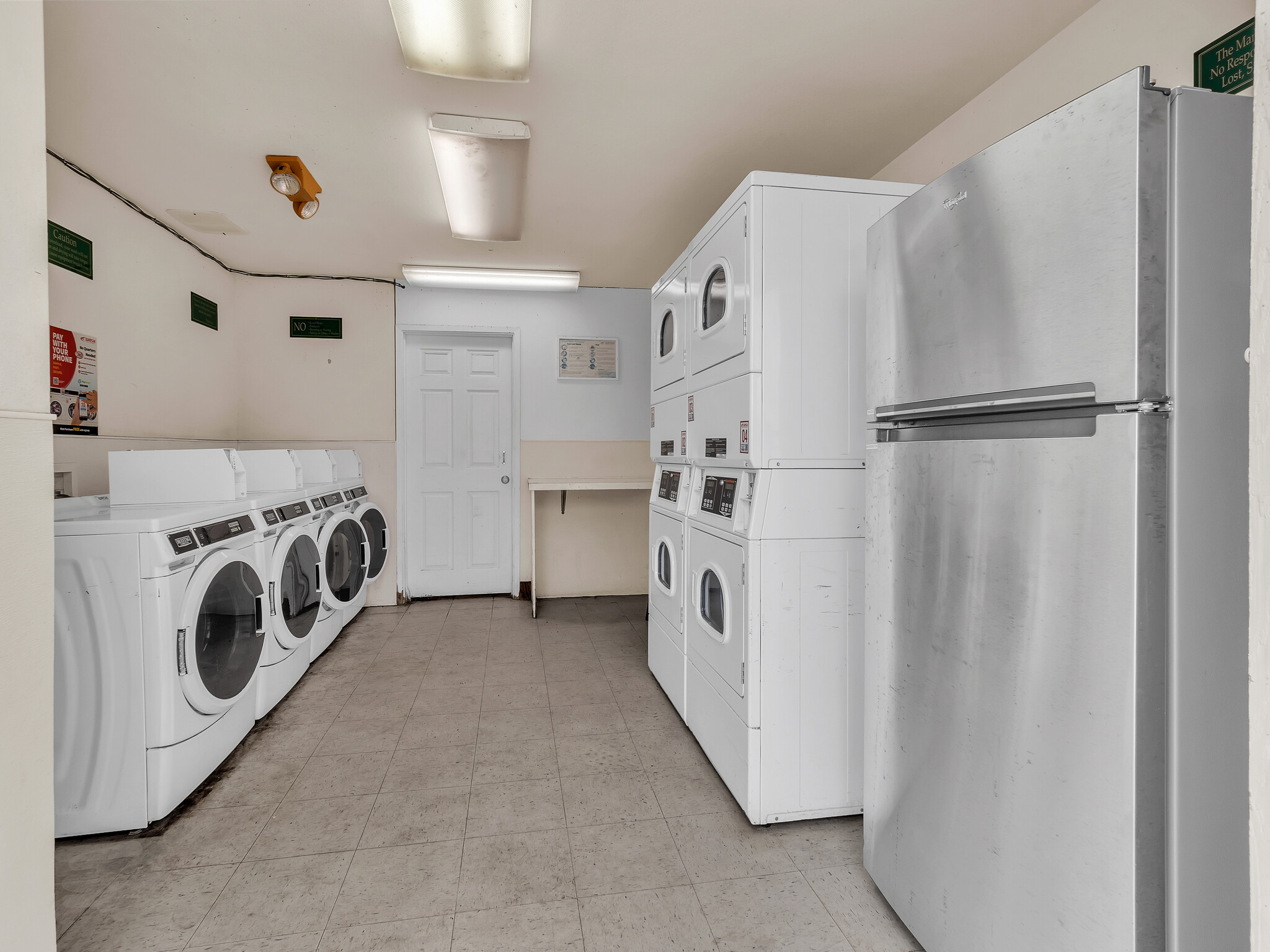 68-3883 Lua Kula Street, Unit 2102 Waikoloa, HI 96738 - Photo 26 of 29 a utility room with cabinets washer and dryer