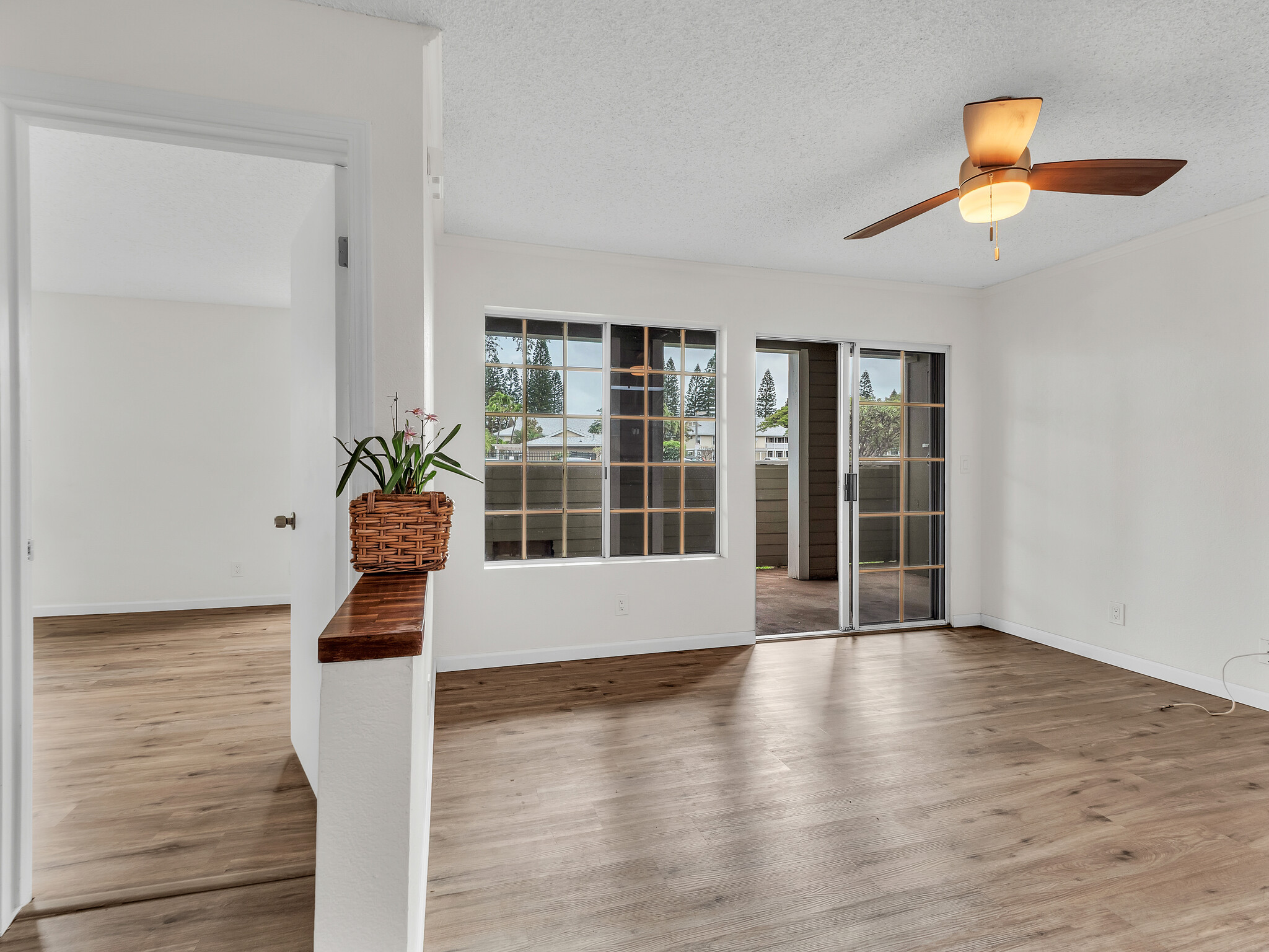 68-3883 Lua Kula Street, Unit 2102 Waikoloa, HI 96738 - Photo 8 of 29 a view of wooden floor and windows in a room