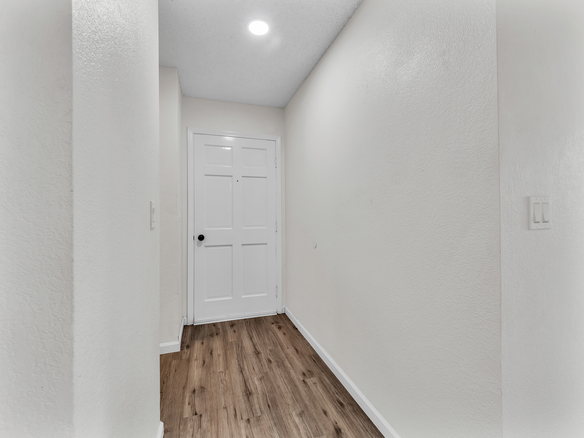 68-3883 Lua Kula Street, Unit 2102 Waikoloa, HI 96738 - Photo 9 of 29 a view of a room with wooden floor