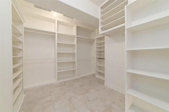 a view of an empty walk in closet