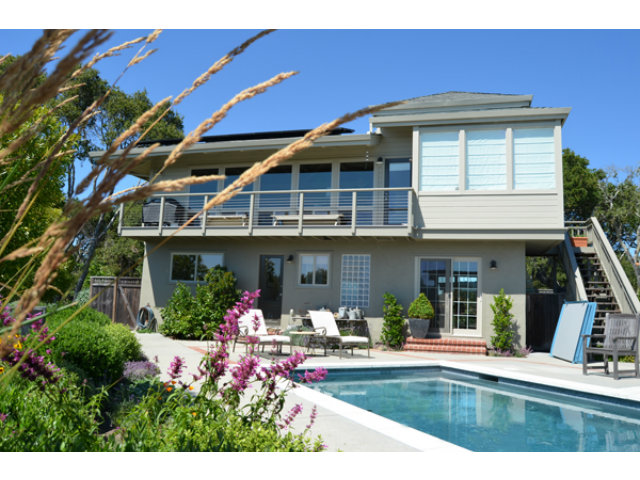 102 Las Lomas Drive Aptos, CA 95003 - Photo 11 of 25 a front view of a house with chair and tables