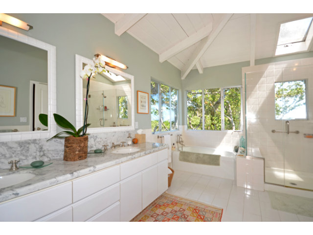 102 Las Lomas Drive Aptos, CA 95003 - Photo 6 of 25 a bathroom with a double vanity sink a mirror and a bathtub