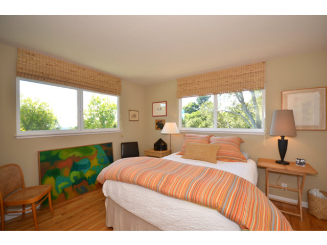 102 Las Lomas Drive Aptos, CA 95003 - Photo 7 of 25 a bedroom with a bed and a window