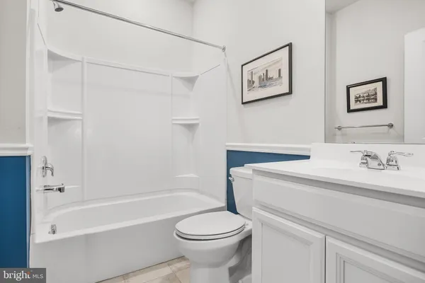 a bathroom with a sink a toilet and a bathtub