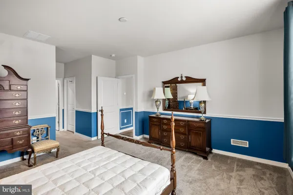 a bed room with a bed and a television