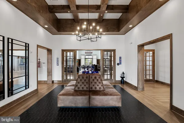 a view of a dining room with furniture wooden floor and chandelier