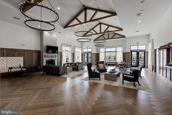 a living room with furniture a fireplace and white walls