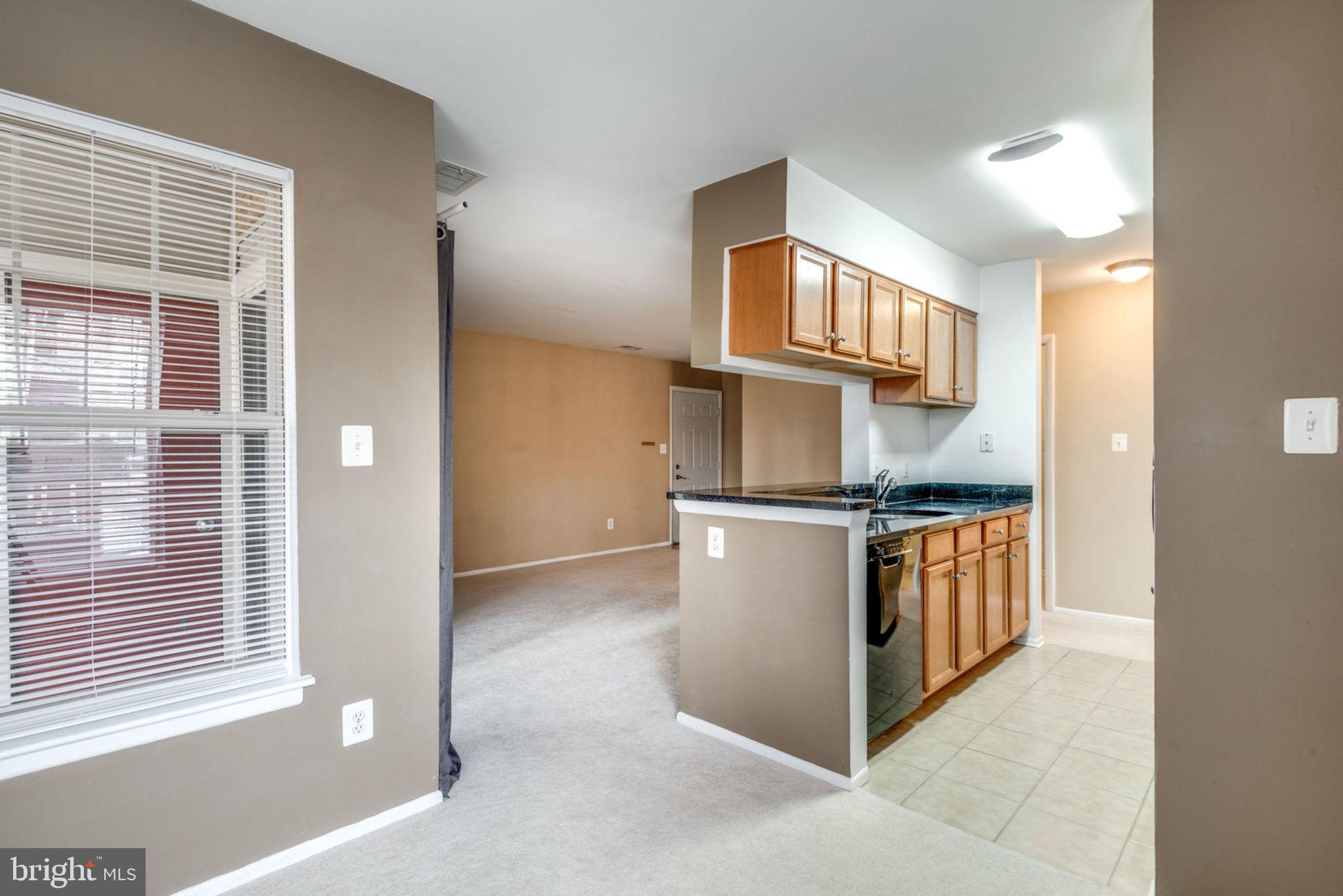 1781 Jonathan Way, Unit B Reston, VA 20190 - Photo 9 of 29 View from Dining Room to Kitchen and Living Room