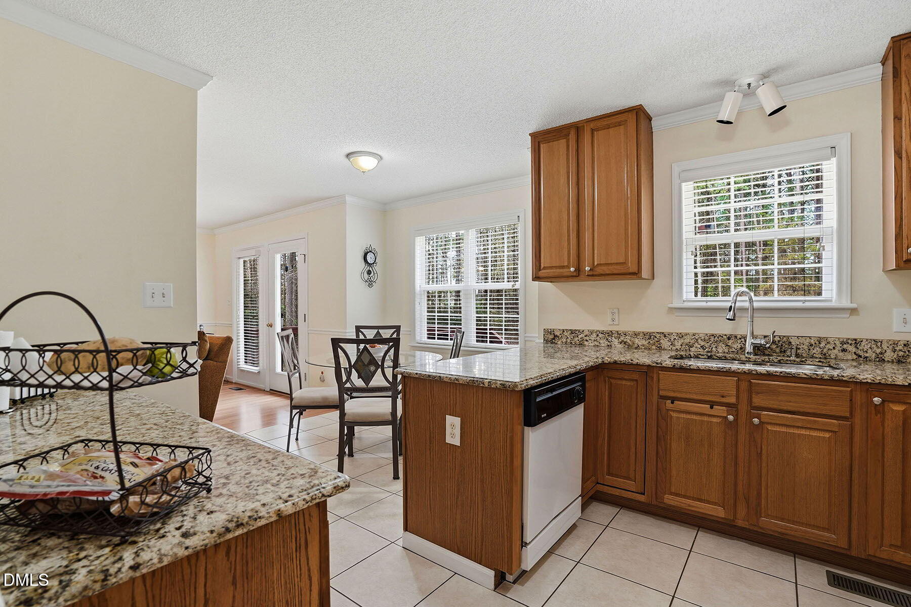317 Atkinson Farm Circle Garner, NC 27529 - Photo 16 of 29 a kitchen with stainless steel appliances granite countertop a stove a sink and a microwave