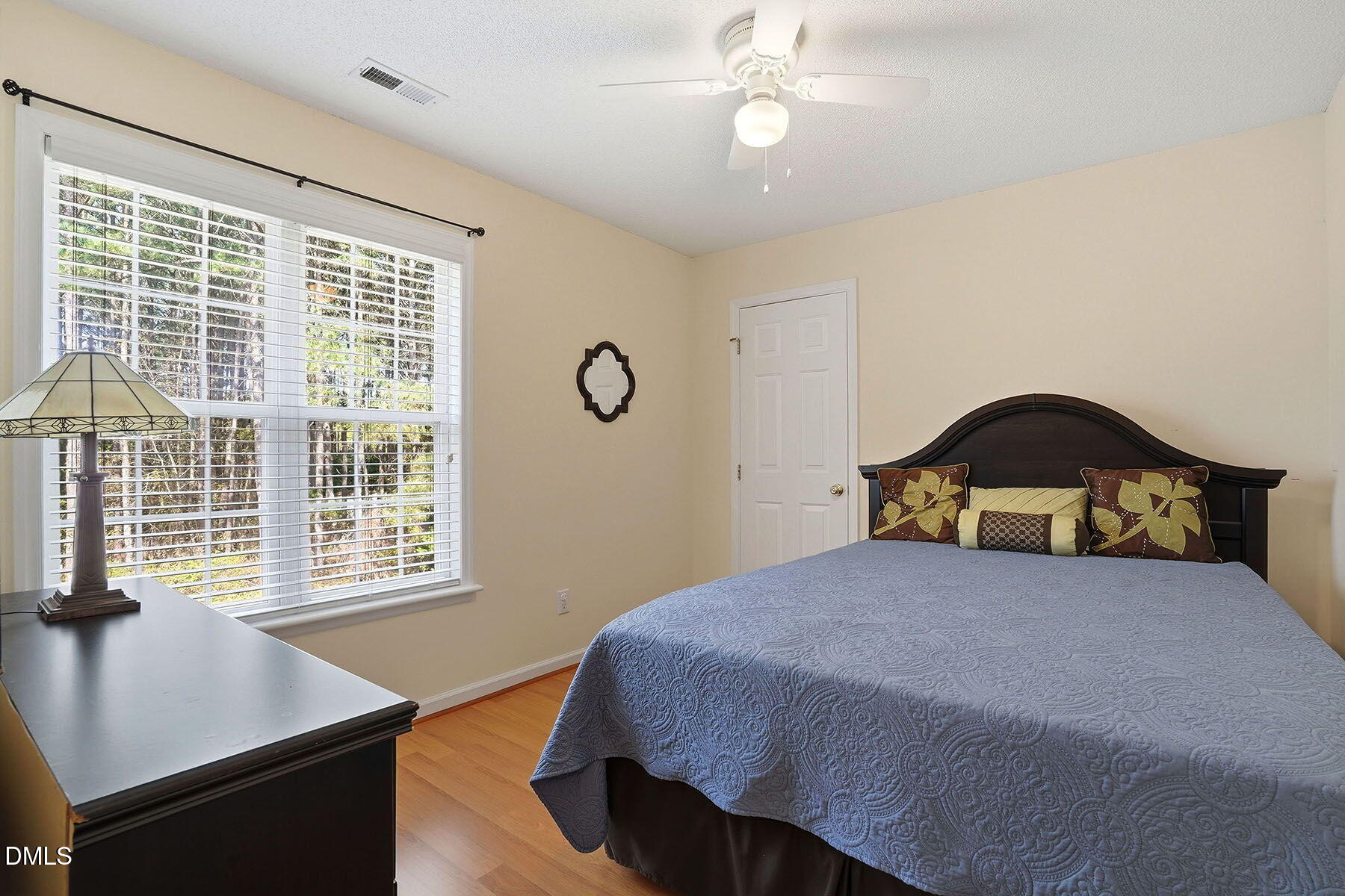 317 Atkinson Farm Circle Garner, NC 27529 - Photo 20 of 29 a bedroom with a bed a table and a window