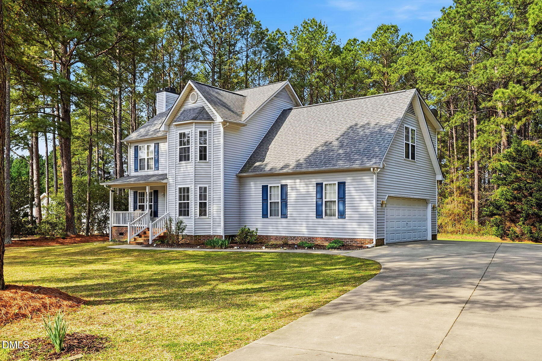 317 Atkinson Farm Circle Garner, NC 27529 - Photo 2 of 29 a front view of house with yard and trees in the background