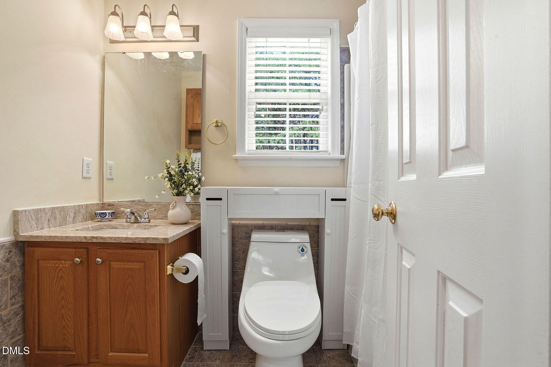 317 Atkinson Farm Circle Garner, NC 27529 - Photo 22 of 29 a bathroom with a toilet sink and mirror