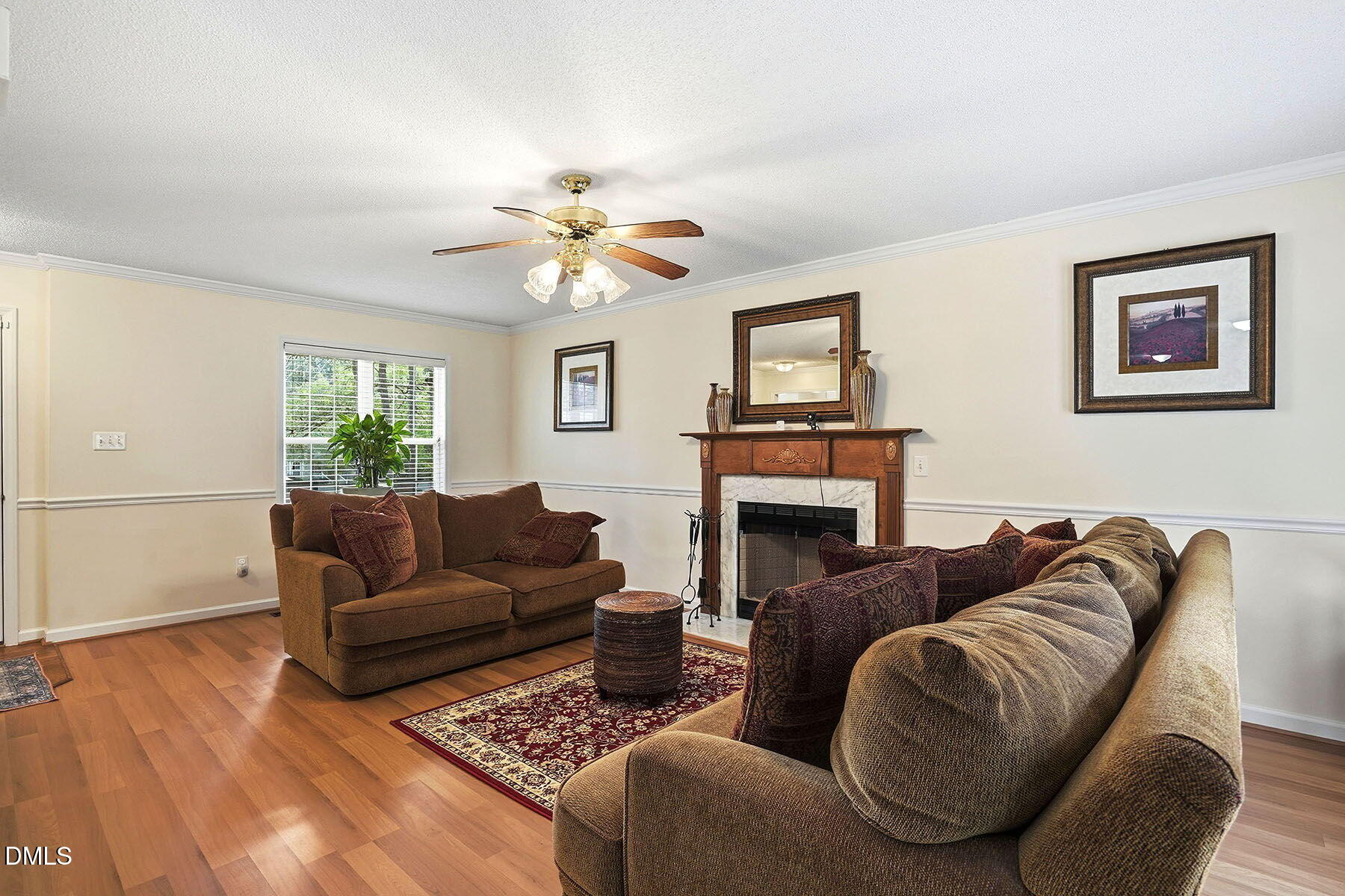 317 Atkinson Farm Circle Garner, NC 27529 - Photo 6 of 29 a living room with furniture and a fireplace