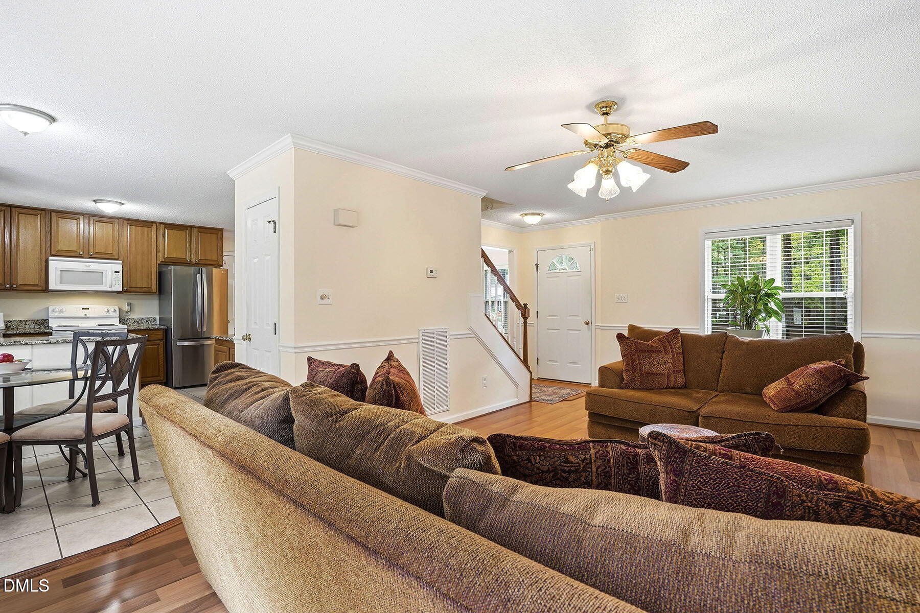 317 Atkinson Farm Circle Garner, NC 27529 - Photo 7 of 29 a living room with furniture and a large window