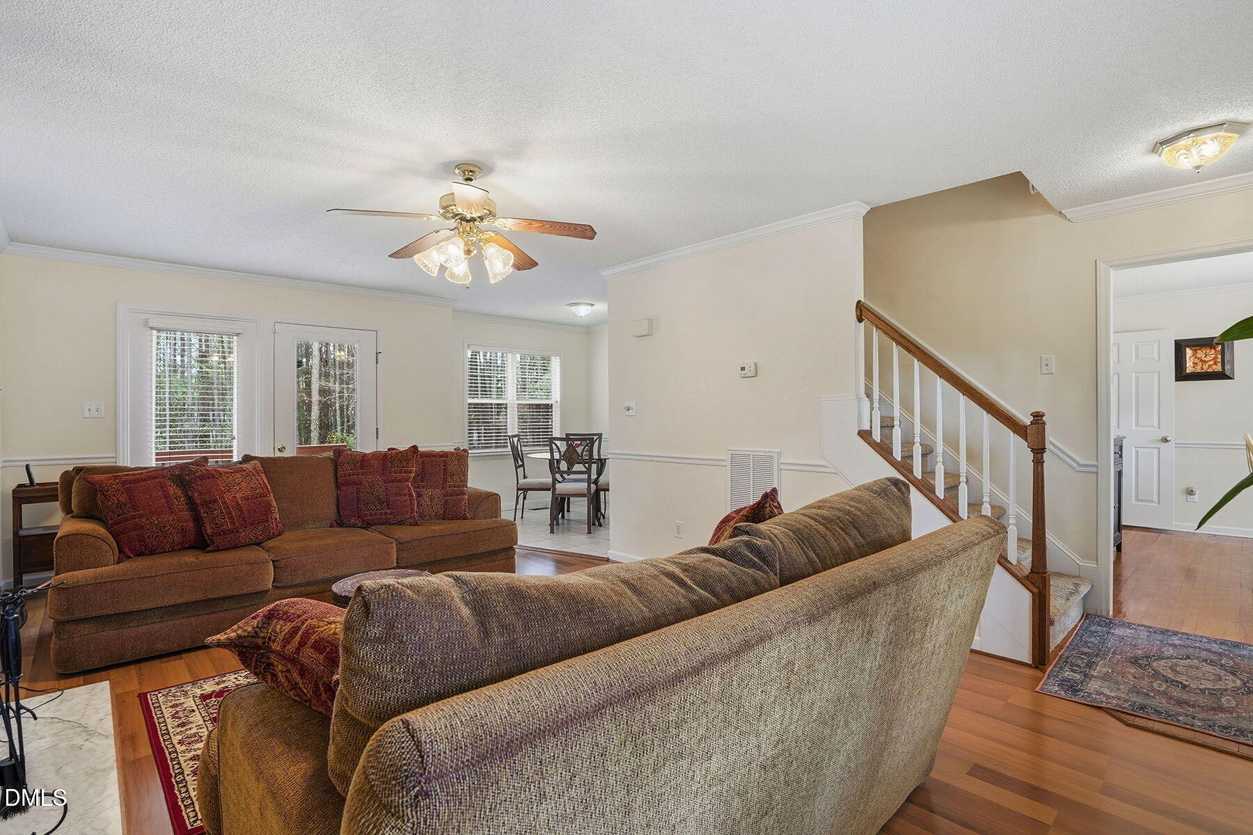 317 Atkinson Farm Circle Garner, NC 27529 - Photo 8 of 29 a living room with furniture and a chandelier