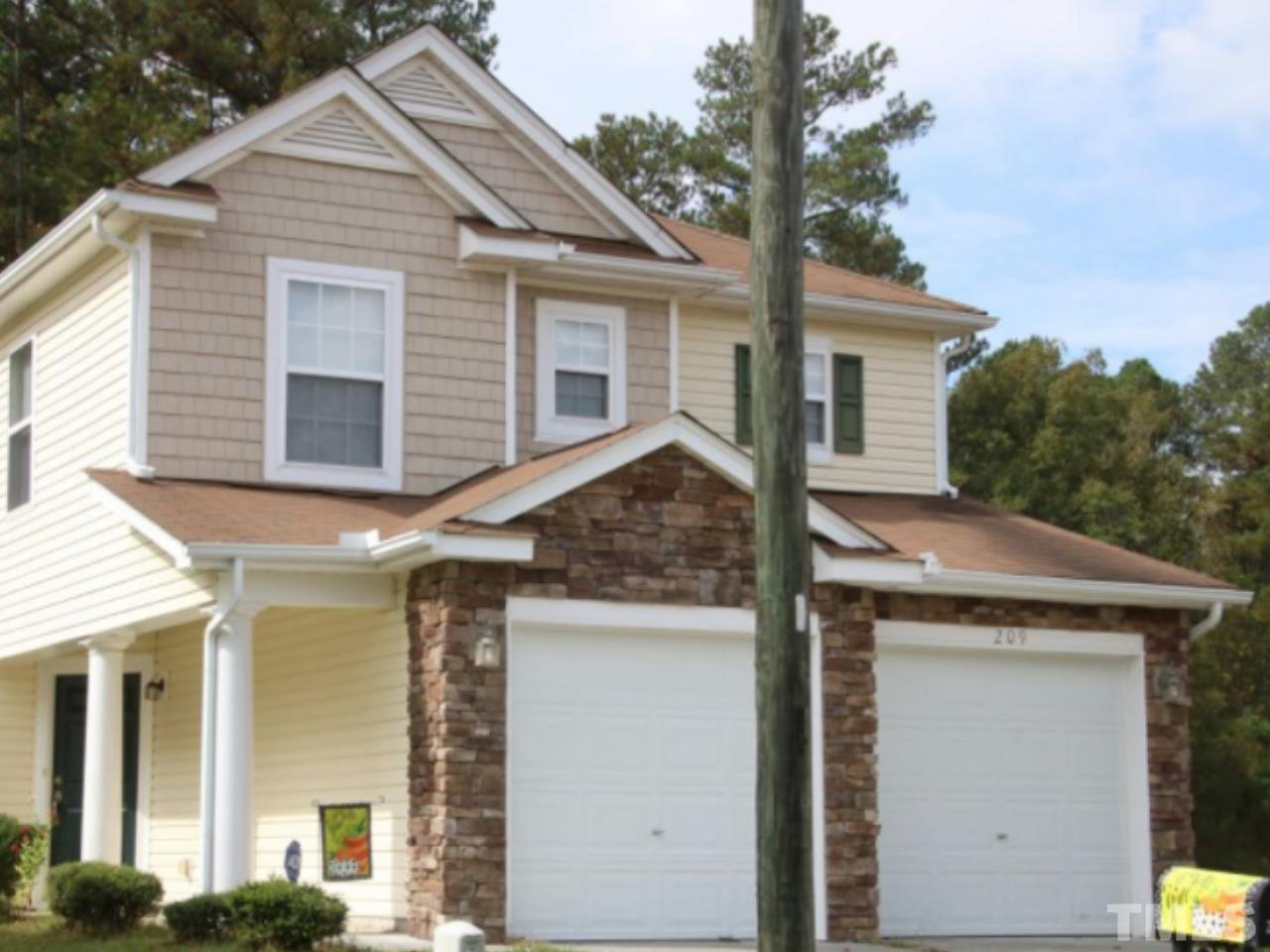 a view of a house with a tree
