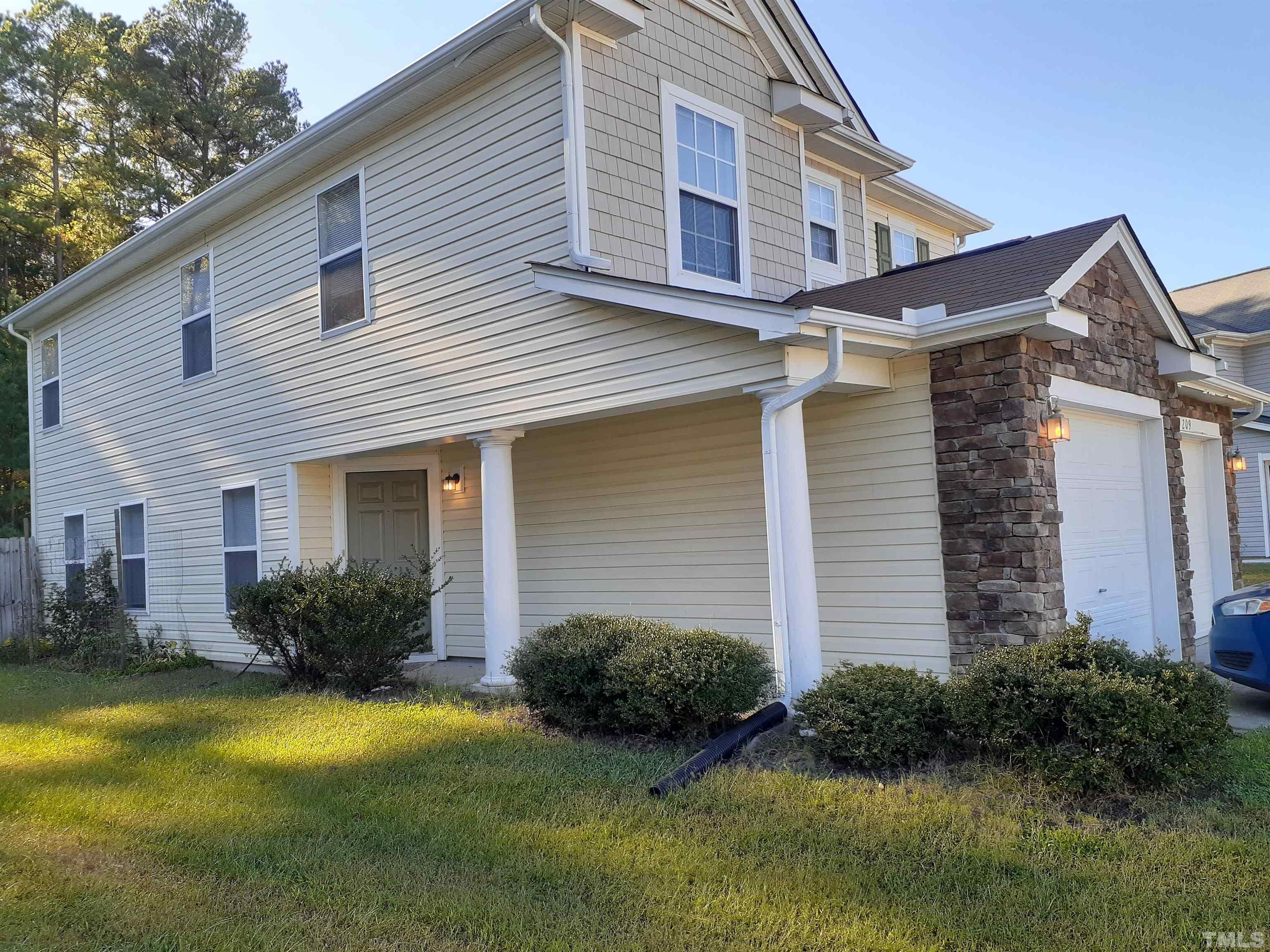209 Lodestone Drive Durham, NC 27703 - Photo 2 of 30 a view of a house with pool and garden
