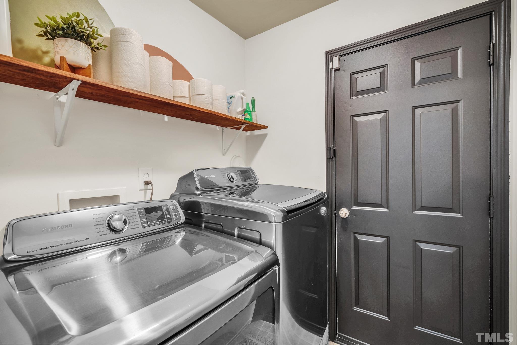 209 Lodestone Drive Durham, NC 27703 - Photo 16 of 30 a utility room with dryer and washer