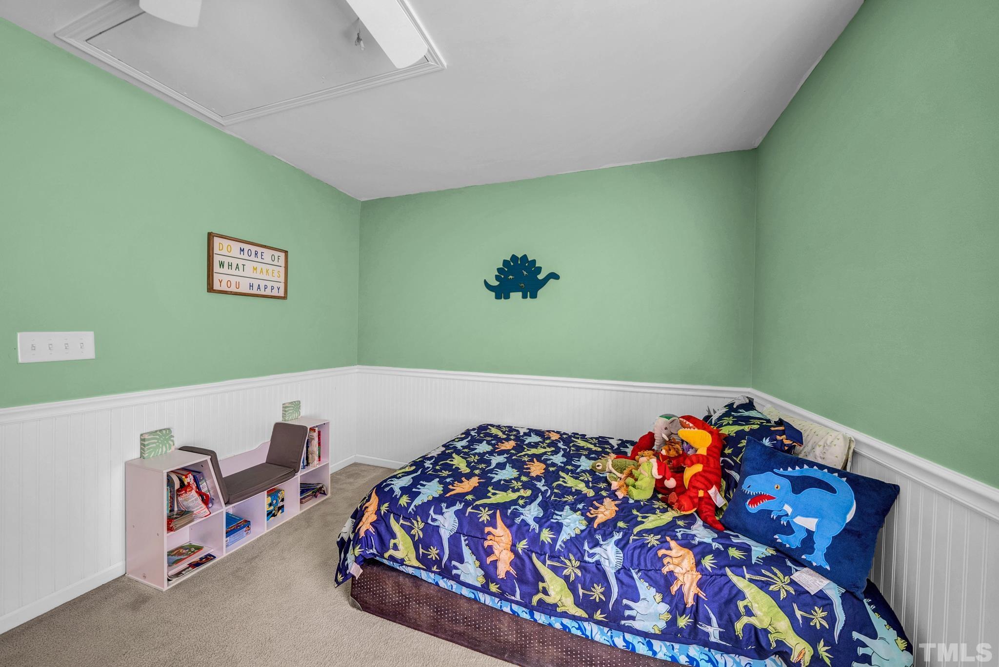 209 Lodestone Drive Durham, NC 27703 - Photo 22 of 30 a bedroom with a bed and a painting on the wall
