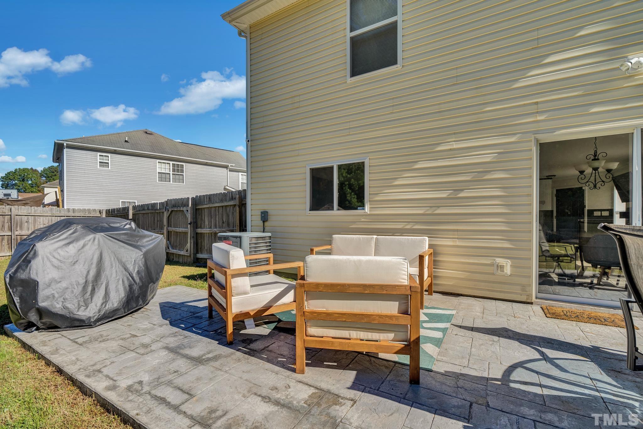 209 Lodestone Drive Durham, NC 27703 - Photo 26 of 30 a view of a patio with table and chairs with wooden floor and fence