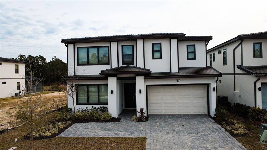 1291 Butterfly Orchid Road Davenport, FL 33837 - Photo 2 of 67