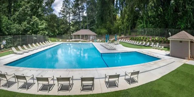 a view of a swimming pool with a patio
