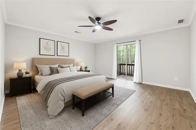 a spacious bedroom with a bed and window