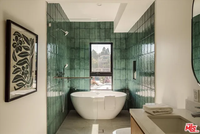 a bathroom with a bathtub and shower
