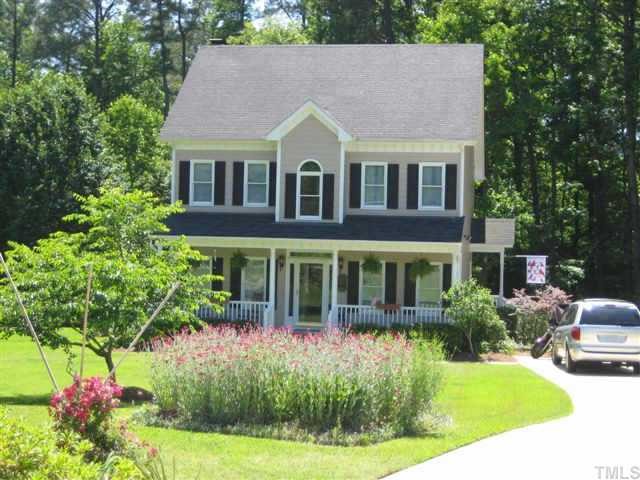 6032 Swales Way Raleigh, NC 27603 - Photo 1 of 1 a aerial view of a house with a yard and potted plants