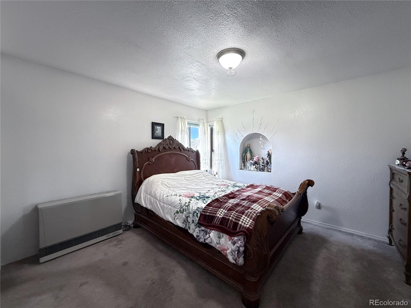 20899 County Rd L.7 San Luis, CO 81152 - Photo 13 of 36 a bedroom with a bed and window