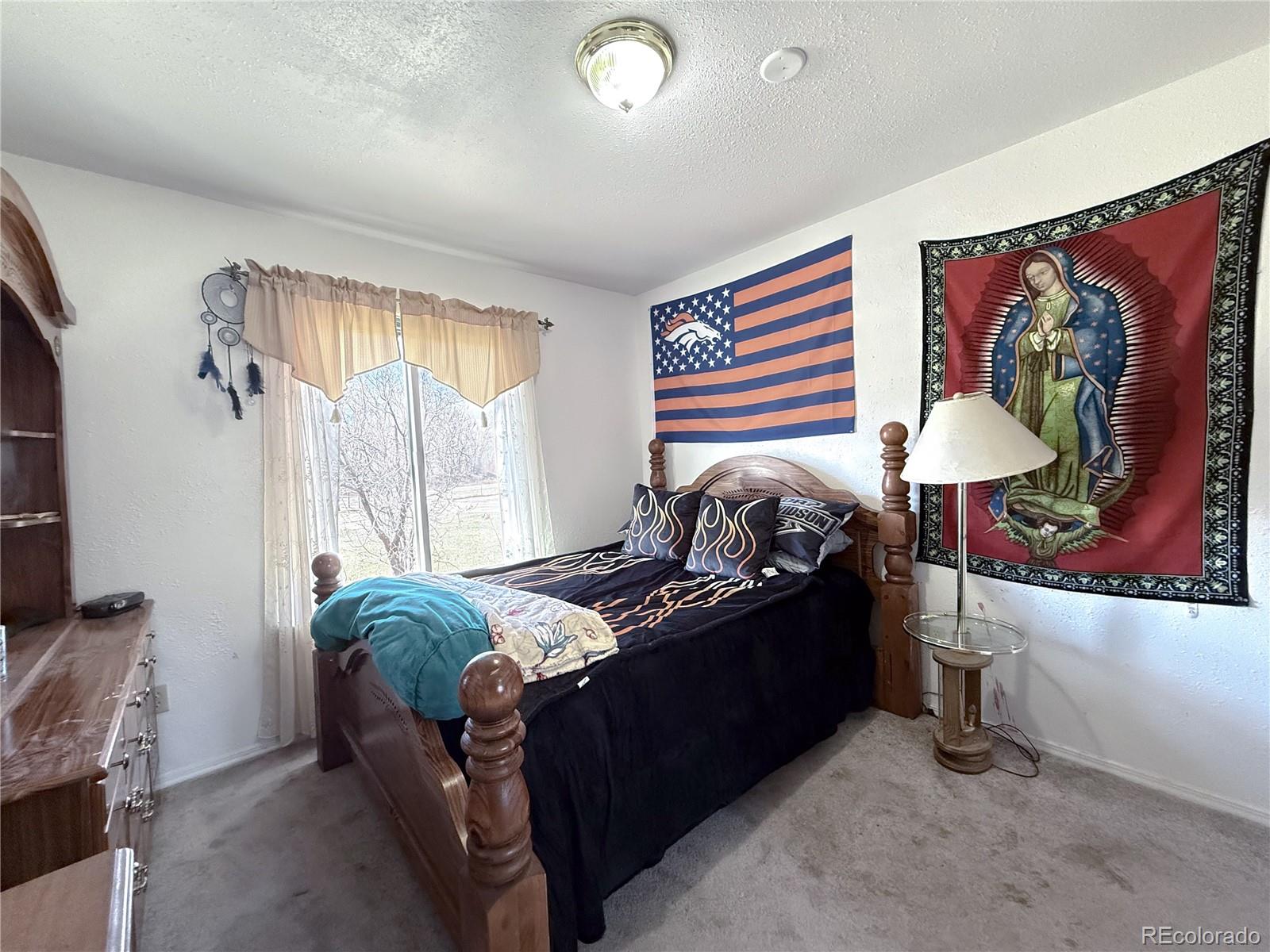 20899 County Rd L.7 San Luis, CO 81152 - Photo 19 of 36 a bedroom with furniture and a window
