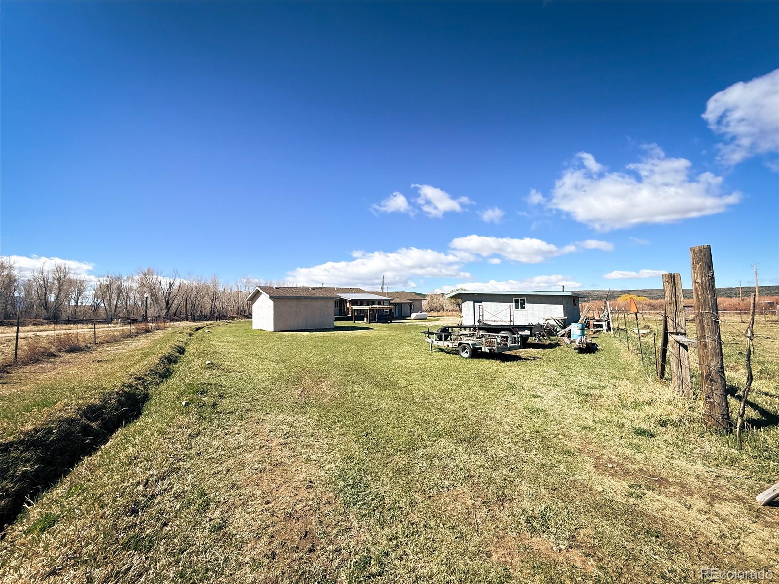 20899 County Rd L.7 San Luis, CO 81152 - Photo 27 of 36 a view of a house with a yard