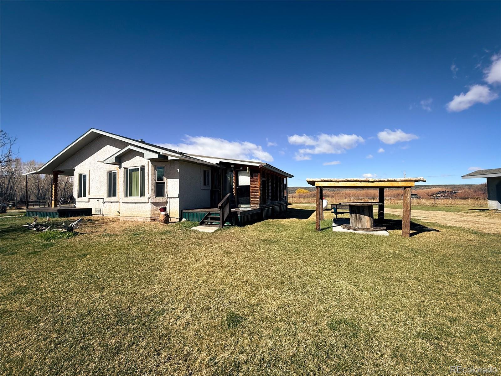 20899 County Rd L.7 San Luis, CO 81152 - Photo 4 of 36 a view of a house with a patio