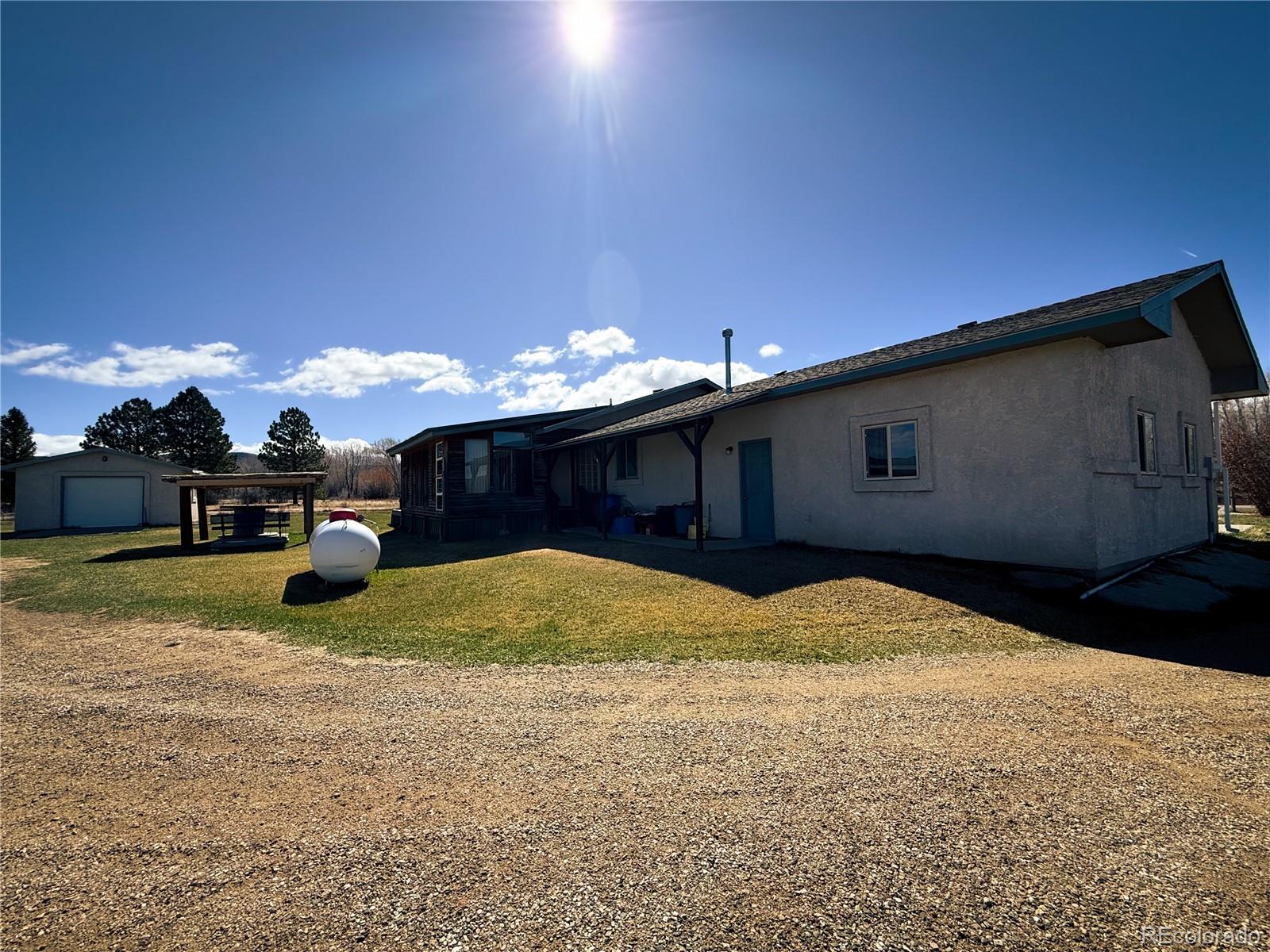 20899 County Rd L.7 San Luis, CO 81152 - Photo 5 of 36 a swimming pool with barbeque in front of it