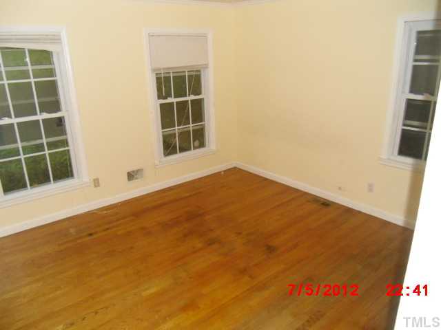 4204 Boxwood Road Raleigh, NC 27612 - Photo 7 of 13 an empty room with windows