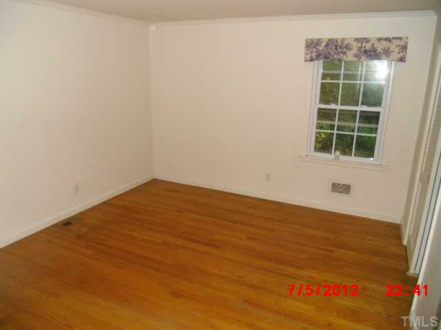4204 Boxwood Road Raleigh, NC 27612 - Photo 8 of 13 an empty room with a window