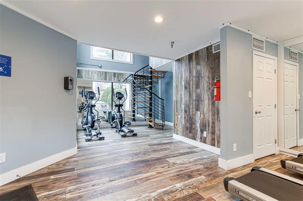 2330 Cobb Parkway Southeast, Unit 322 Smyrna, GA 30080 - Photo 11 of 19 a view of a room with gym equipment