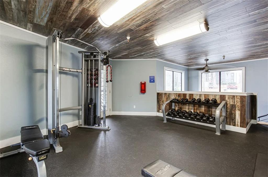 2330 Cobb Parkway Southeast, Unit 322 Smyrna, GA 30080 - Photo 15 of 19 a bedroom with furniture and a window
