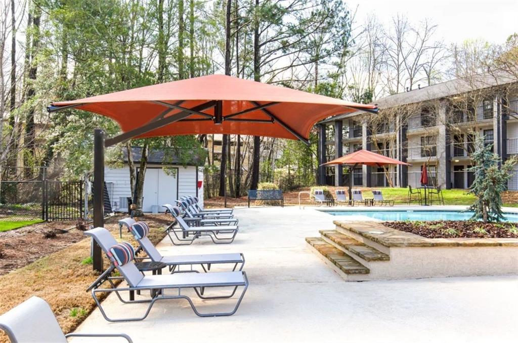 2330 Cobb Parkway Southeast, Unit 322 Smyrna, GA 30080 - Photo 18 of 19 a view of a house with backyard porch and sitting area