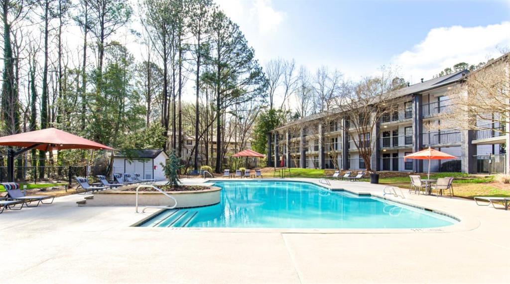 2330 Cobb Parkway Southeast, Unit 322 Smyrna, GA 30080 - Photo 19 of 19 a view of a swimming pool with a patio