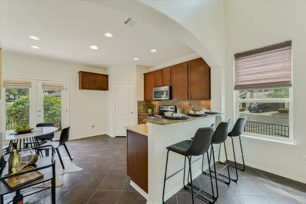a view of a dining room with furniture window and outside view
