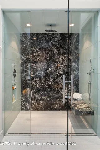 a bathroom with a tub sink and shower