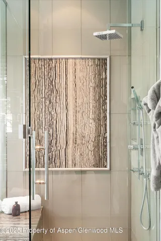 a kitchen with a sink cabinets and wooden floor