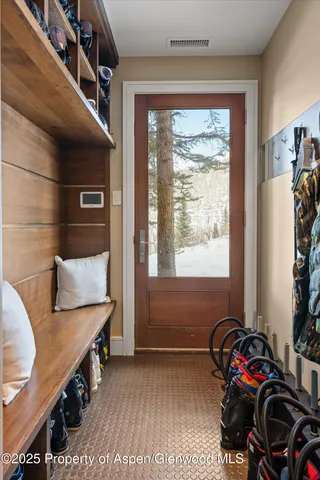 a bathroom with a sink a toilet a shower and a mirror