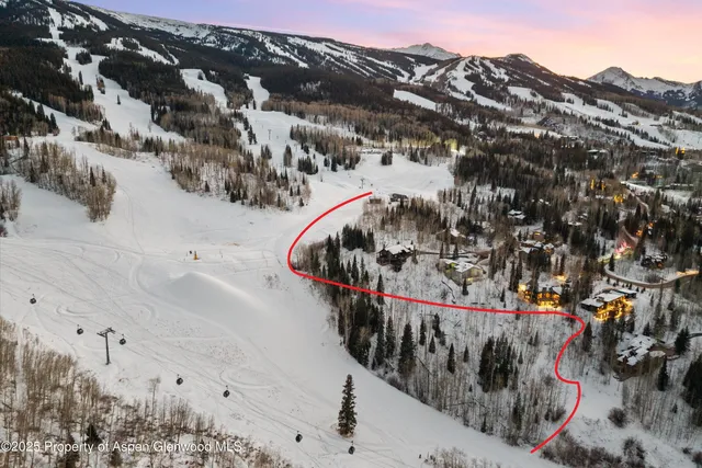 a view of a backyard with a barn and a fountain