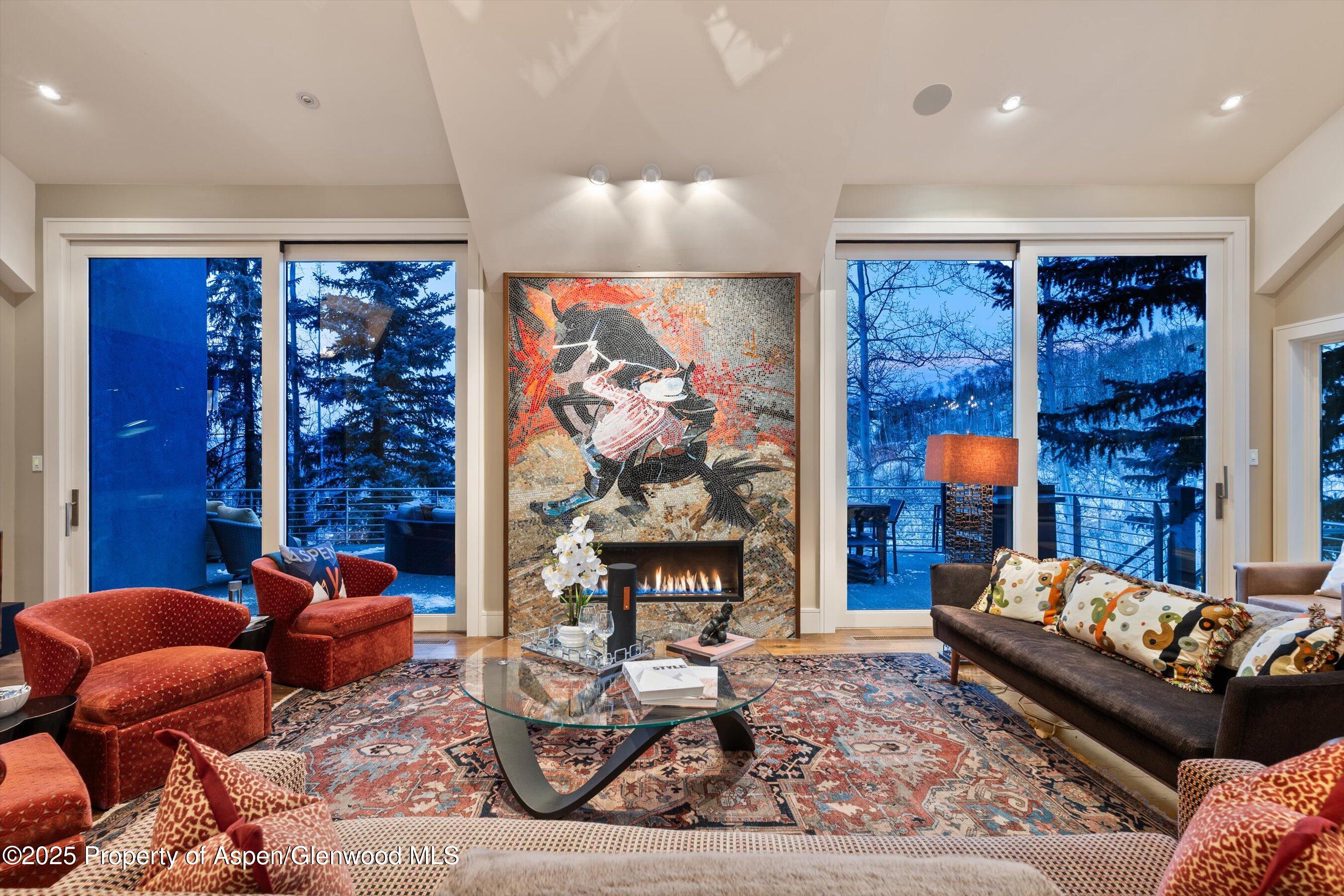 1248 Wood Road Snowmass Village, CO 81615 - Photo 3 of 43 a living room with furniture a rug and a fireplace