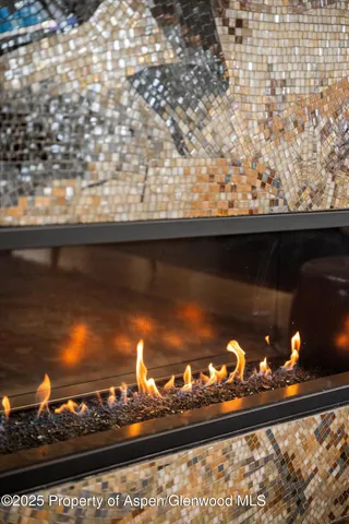 a living room with fireplace furniture and a flat screen tv