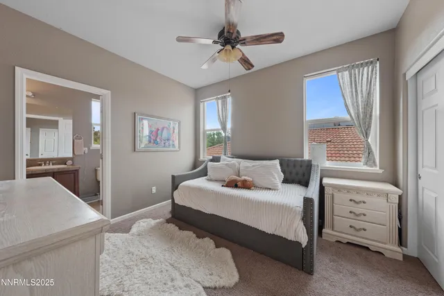 an aerial view of residential houses with outdoor space and street view
