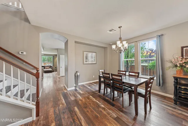 a kitchen with stainless steel appliances granite countertop a refrigerator stove microwave sink and cabinets